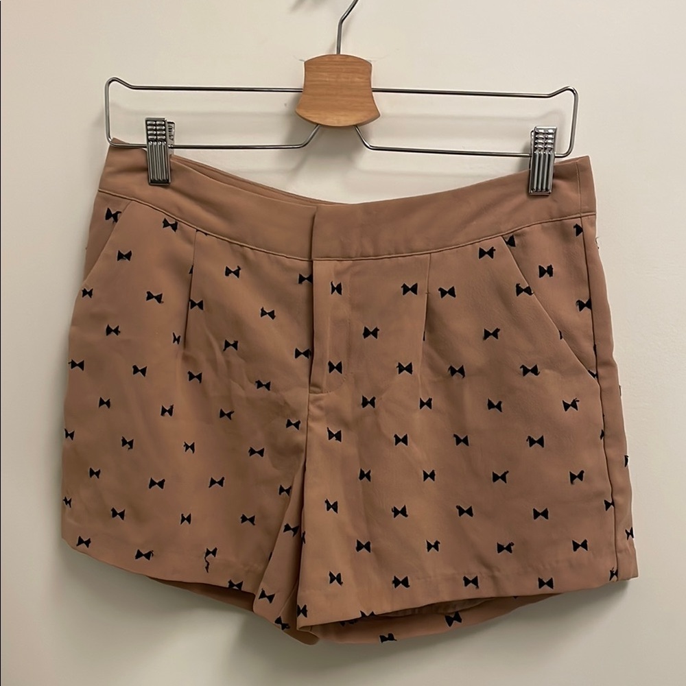 Stylish Tan Shorts with Black Bow Pattern